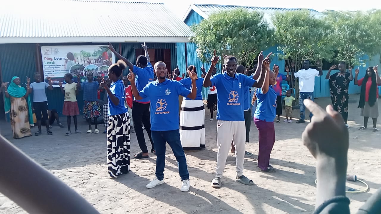 Children and young people participating in a Play for Peace activity